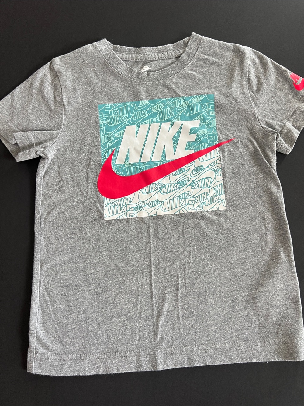 Nike Kids Short Sleeve Gray Tee with Pink Swoosh and Teal Box